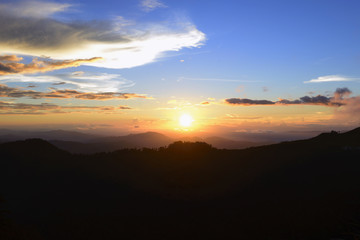 The sunset at the mountain with the twilight scene.