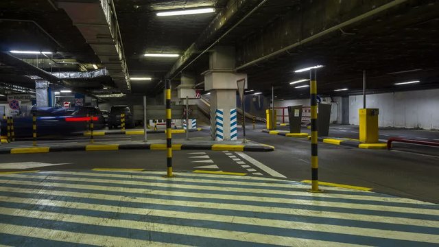 motion in underground parking of hypermarket ,shopping mall ,time lapse
