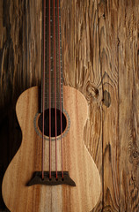 Fototapeta premium ukulele bass on aged wood