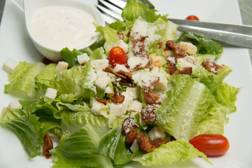  Caesar salad  croutons,  bacon, parmesan cheese and Caesar dres