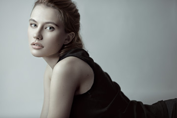 Fashion portrait of a sensual girl with red hair.