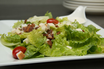  Caesar salad  croutons,  bacon, parmesan cheese and Caesar dres