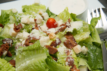  Caesar salad  croutons,  bacon, parmesan cheese and Caesar dres