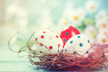 Easter concept with colored eggs on wooden background