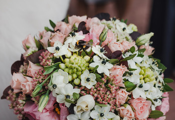 Beautiful bride's bouquet with bumblebee