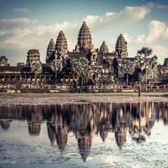 Ancient Khmer architecture. Amazing view of Angkor Thom temple under blue sky. Angkor Wat complex,...
