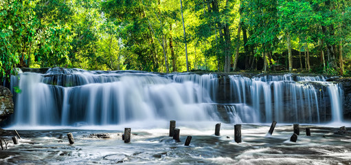Tropical rainforest landscape with flowing blue water of Kulen waterfall in Cambodia