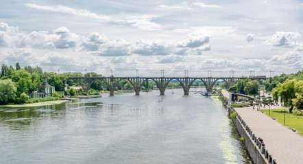 High arched railway bridge made of concrete across the Dnieper River in the city of Dnepropetrovsk. Ukraine, 9 July 2016