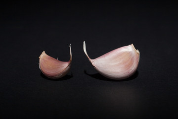 clove of garlic on black background
