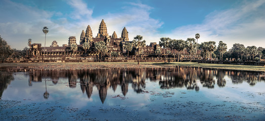 Ancient Khmer architecture. Amazing view of Angkor Thom temple under blue sky. Angkor Wat complex, Siem Reap, Cambodia travel destinations. Six vertical images panorama