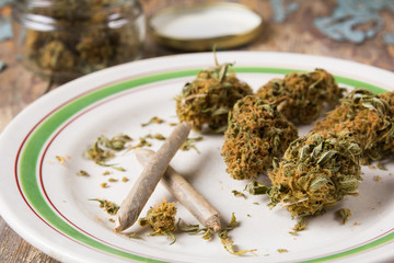 Marijuana buds and joints in the white plate