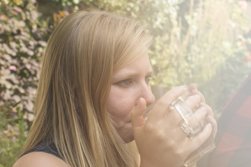 Young woman drinking tea