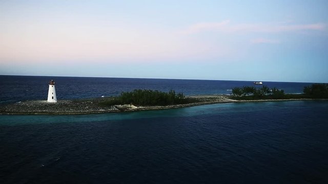 White lighthouse on an island in the Caribbean, aerial.