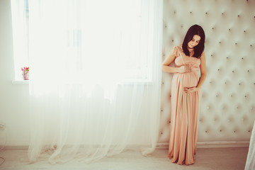 Pregnant woman in a beautifull dress