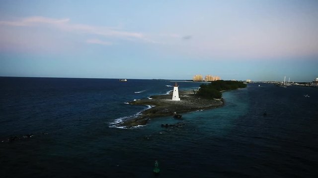White lighthouse on an island in the Caribbean, aerial.