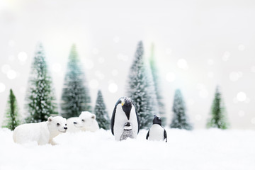 Christmas pinguins, polar and grizzly bears in Snowy Winter Forest