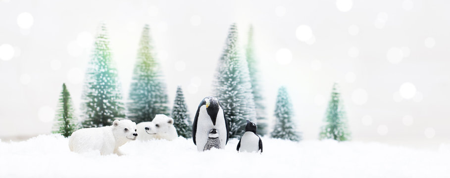 Christmas pinguins, polar and grizzly bears in Snowy Winter Forest