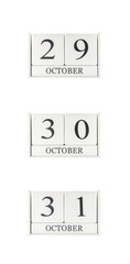 Closeup group of white wooden calendar with black 29 , 30 , 31 october word , three date calendar isolated on white background