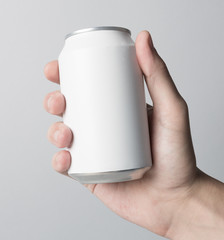 Blank Can in hand on white background, ready to replace your design
