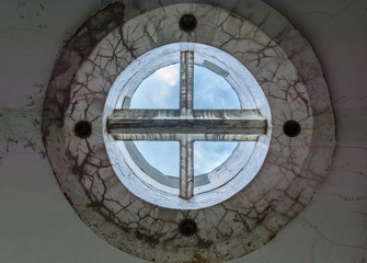 strange and futuristic concrete round shape design on the ceiling. The windows without glass.