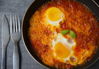 Individual portion of shakshuka. Israeli traditional dish
