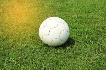 old white soccer football on grass field