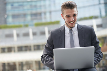 businessman working outside office building