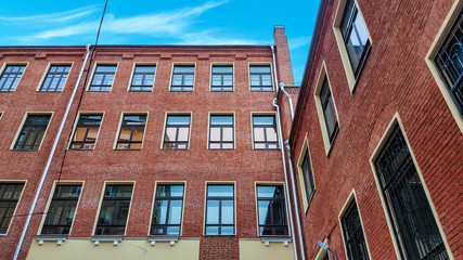 Administrative building. Brick  with windows on sky back