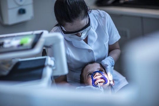 Boy in dental surgery receiving orthodontic treatment