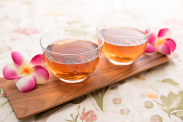 glasses of tea on wooden plate