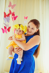 happy young mother and her little daughter together