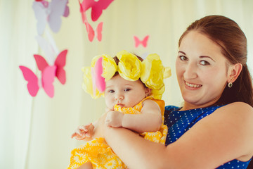 Charming mother and her daughter looking at the camera