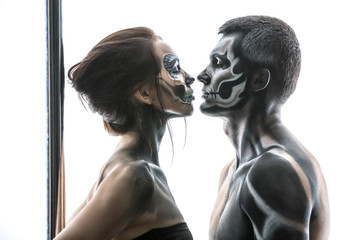 Posing of pole dance couple in studio