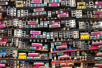 Old computer motherboards. Piles of obsolete hardware and electronics waste