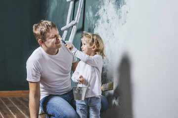 Family, happy daughter with dad doing home repair, paint walls,