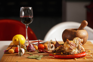 Roasted chicken with vegetables on table