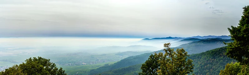Foto auf Glas Beautiful mountains landscape from the top of the hill with fog © 31etc