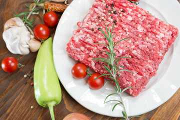 Raw fresh ground beef meat - minced meat on plate