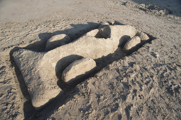 Fototapeta na wymiar Car shaped sand castle