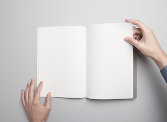 Hand is holding opened Notebook