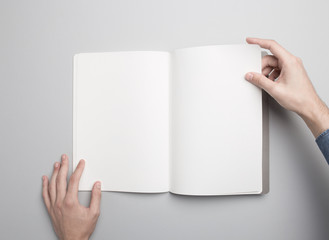 Hand is holding opened Notebook