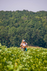 Tourists in the lush greenery of the day