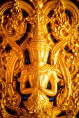 Fototapeta na wymiar the perforate on the door in public temple in Thailand, this picture is generic art in Thailand it is not trademark in this picture