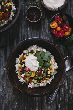 A bowl of Mexican Burrito Bowl topped with cashew chipotle cream