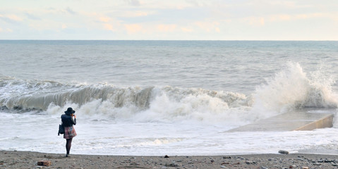 Fototapeta na wymiar woman at the sea during a storm