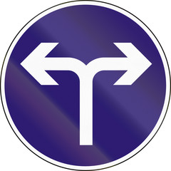Road sign used in Hungary - Turn left or right ahead