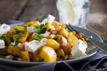 Salad with roasted sweet potato, feta and pomegranate