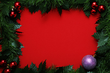 Frame from Christmas tree branches and red balls