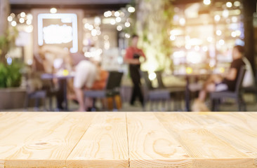 Empty wooden table space platform and blurred resturant background for product display montage...