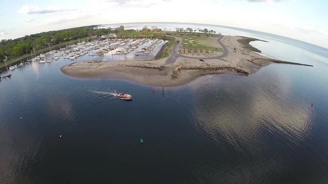 Aerial over marina, Small boat leaving a marina at Compo Beach in Westport, Conn, USA.